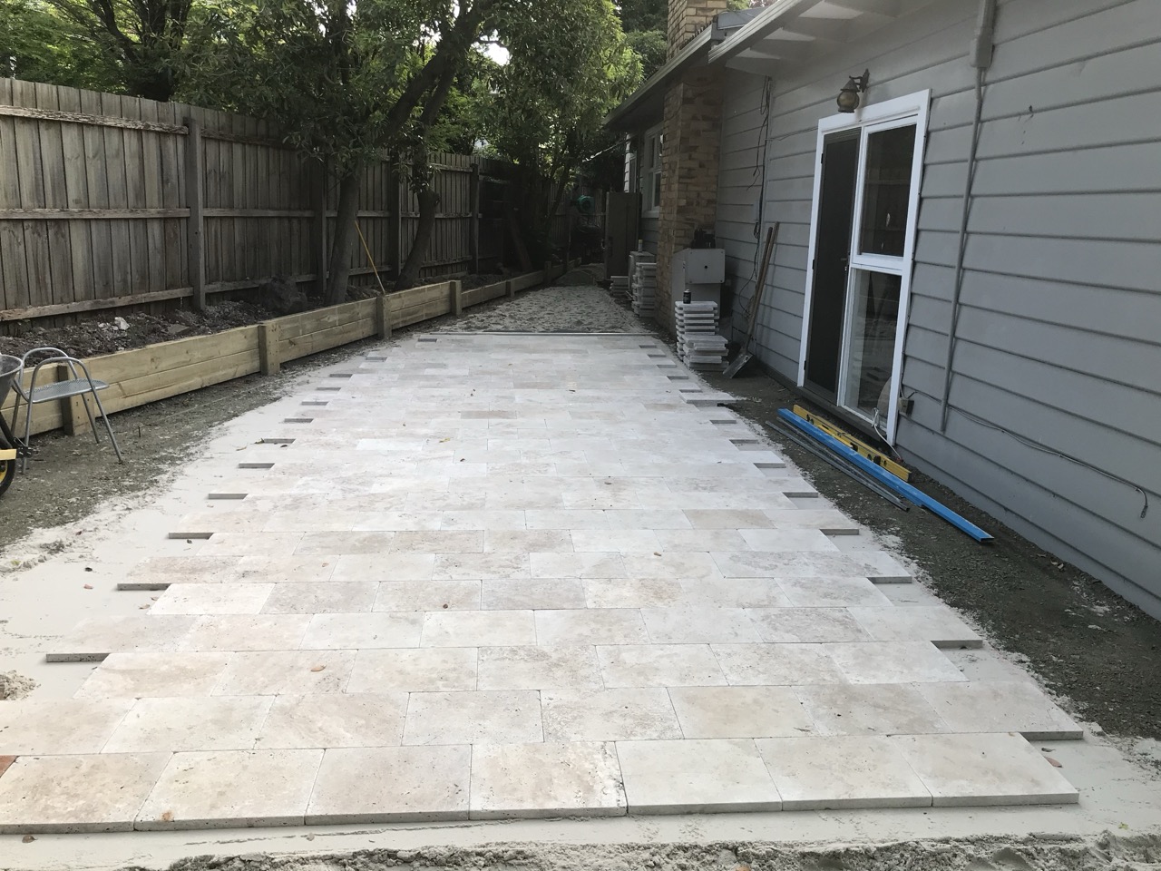 Stone pavers being laid for an outdoor entertaining area