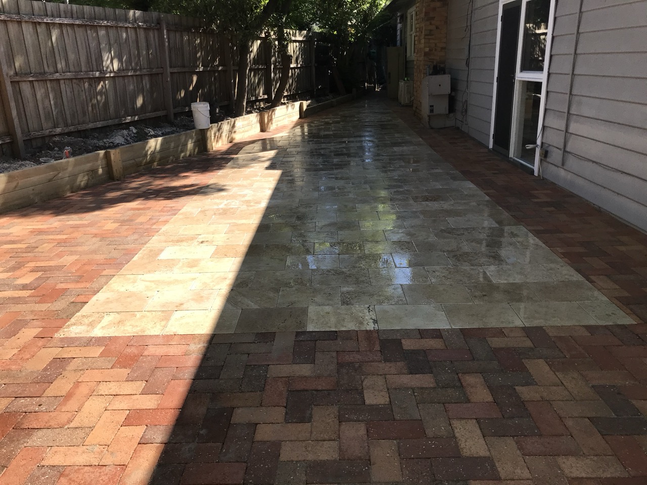 Completed stone and brick patio paving