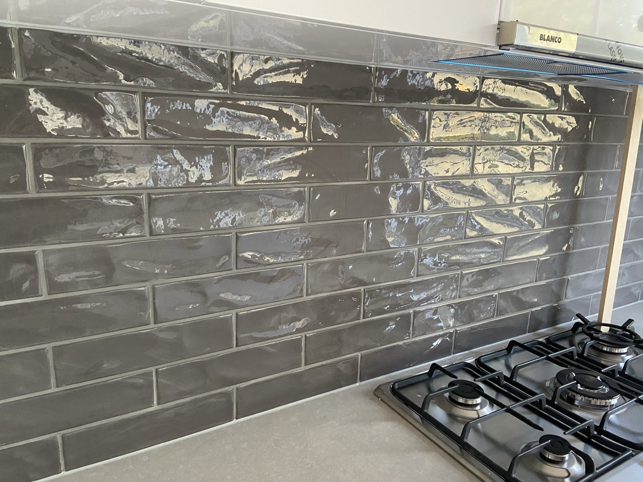 Glossy subway tile kitchen splashback