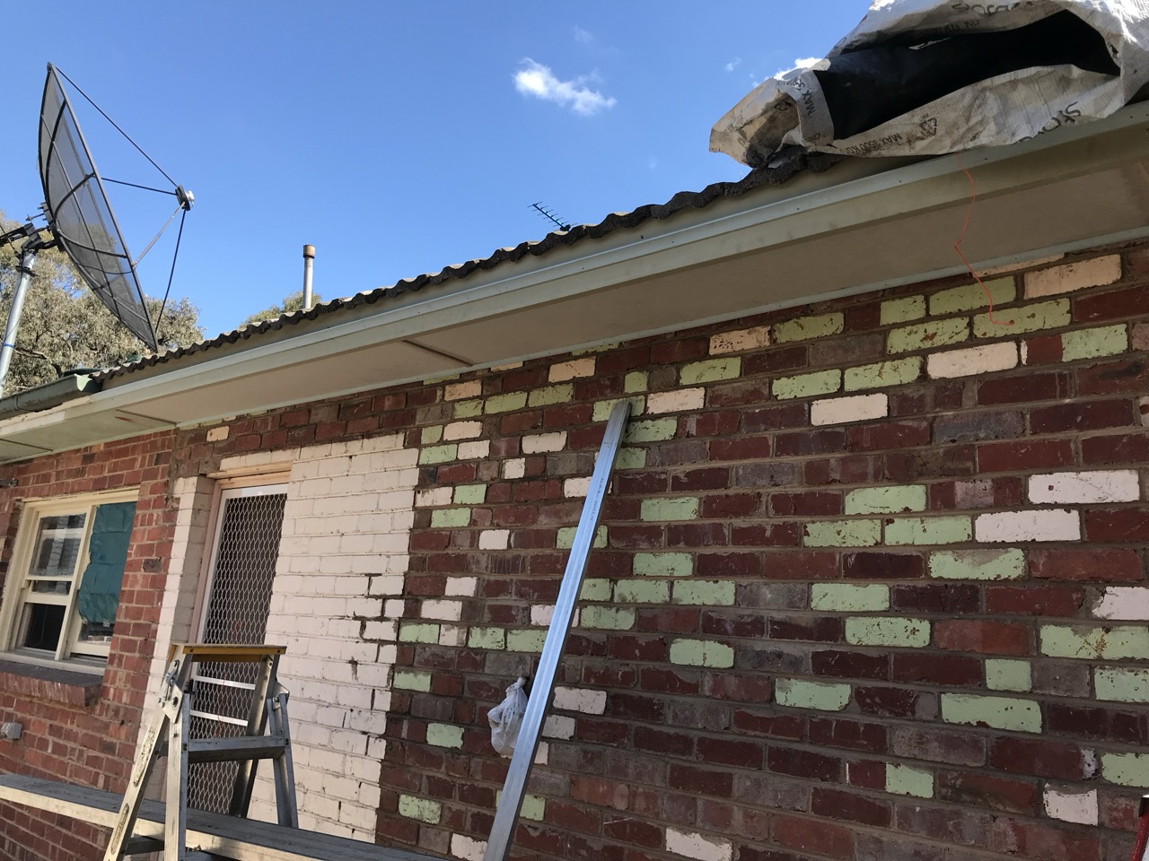 New white eaves installed on a brick home