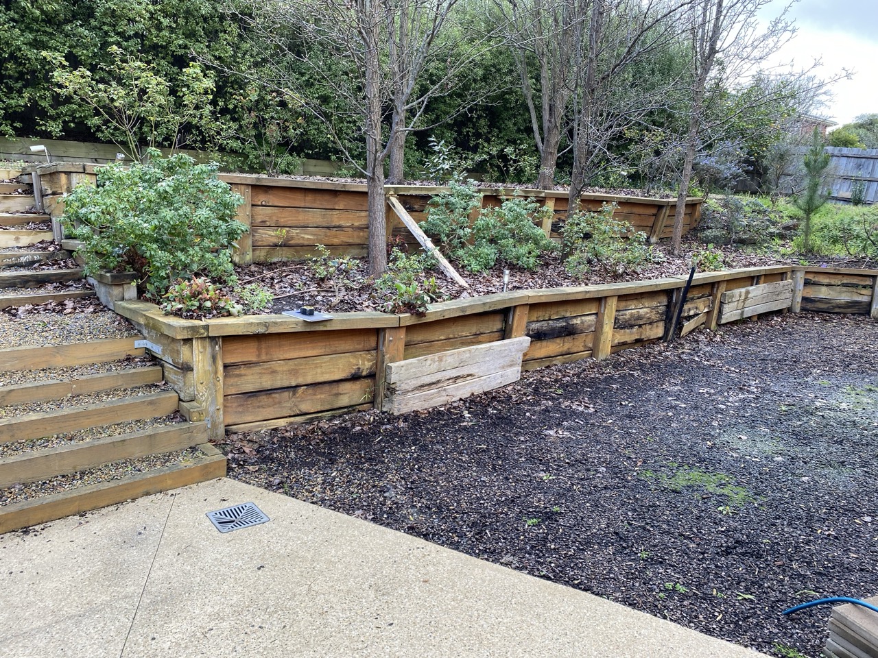 Existing timber retaining walls before replacement