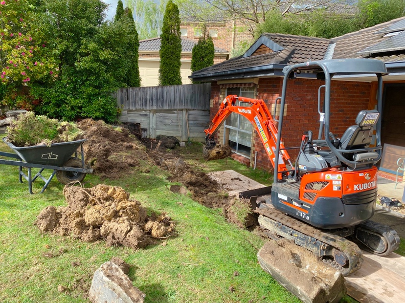 Backyard excavation before a privacy enclosure build
